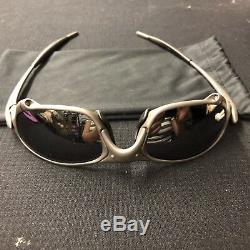 Oakley's Men's X-Metal Juliet Sunglasses Titanium Frame with Emerald lenses